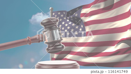 A gavel rests in front of American flag, symbolizing law and justice A gavel rests in front of American flag, symbolizing law and justice 116141749