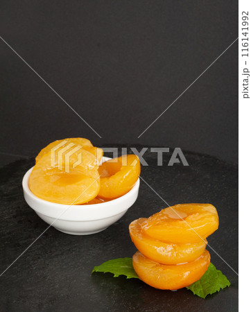 Canned Peaches, Apricot Halves in Syrup, Yellow Fruit Dessert, Tinned Nectarine Compote Canned Peaches, Apricot Halves in Syrup, Yellow Fruit Dessert, Tinned Nectarine Compote 116141992
