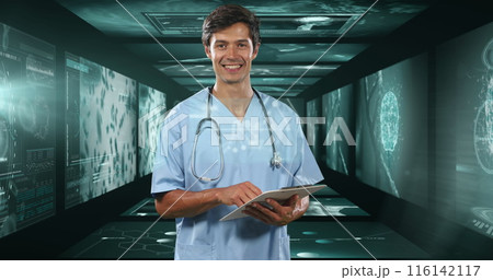 Caucasian male doctor holding tablet in high-tech room Caucasian male doctor holding tablet in high-tech room 116142117