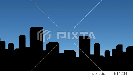 A silhouette of city buildings stands against twilight sky 116142343