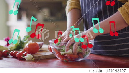 Image of notes over caucasian woman mixing vegetables Image of notes over caucasian woman mixing vegetables 116142407