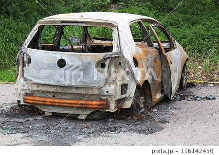 Burnt out car in France Burnt out car in France 116142450