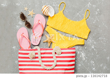 Composition with stylish beach accessories on colored background, top view. Beach fashion flat lay, summer concept. Trendy colors Composition with stylish beach accessories on colored background, top view. Beach fashion flat lay, summer concept. Trendy colors 116142718