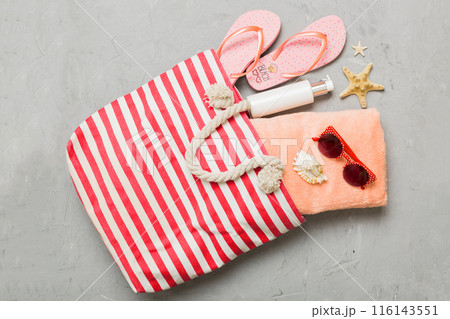 Composition with stylish beach accessories on colored background, top view. Beach fashion flat lay, summer concept. Trendy colors Composition with stylish beach accessories on colored background, top view. Beach fashion flat lay, summer concept. Trendy colors 116143551
