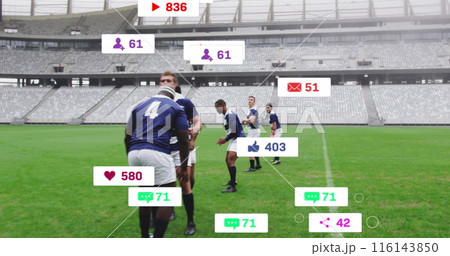 Image of social media icons foating against team of diverse rugby players playing in the stadium 116143850