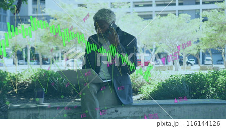 Image of graphs, changing numbers, african american man talking on cellphone and using laptop 116144126