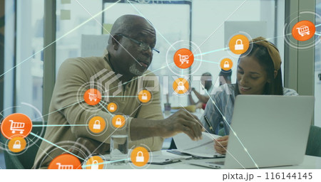 Image of connected icons over diverse coworkers discussing reports on laptop in office Image of connected icons over diverse coworkers discussing reports on laptop in office 116144145