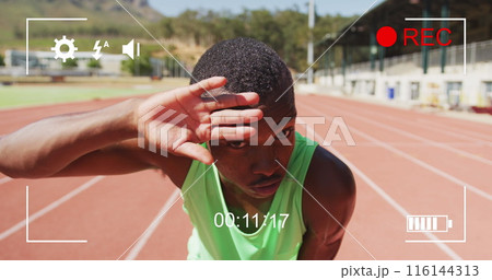 Image of digital interface with recording screen and african american athlete wiping forehead Image of digital interface with recording screen and african american athlete wiping forehead 116144313