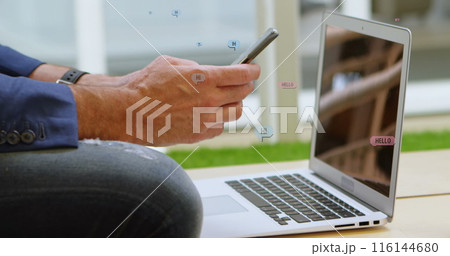 Images of falling social media icons over person using laptop 116144680