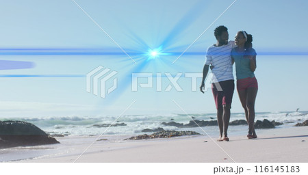 Image of light trails over african american couple at beach Image of light trails over african american couple at beach 116145183