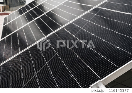 cells of black solar panel in closeup. Renewable green Energy system 116145577