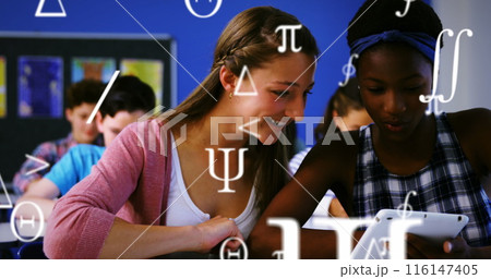 A student using a digital tablet in a classroom 116147405