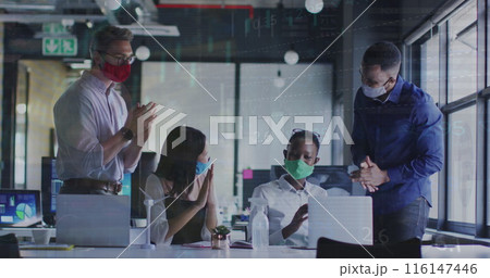 In this image, office colleagues are seen clapping together while wearing face masks 116147446