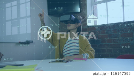 Image of financial data processing with icons over biracial businesswoman using vr headset 116147593