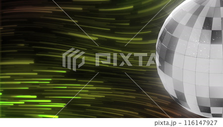 Image of disco ball over light trails on green light trails background 116147927