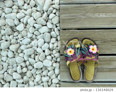 Stones, flip flops on wooden background. Flat lay. Summer holiday concept Stones, flip flops on wooden background. Flat lay. Summer holiday concept 116148029