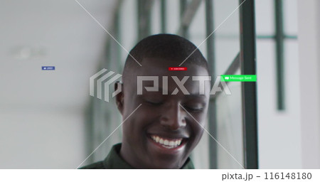 Image of social media icons and numbers over african american businessman in office 116148180