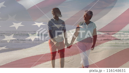 Image of flag of usa over happy senior biracial couple in love walking on beach Image of flag of usa over happy senior biracial couple in love walking on beach 116148631