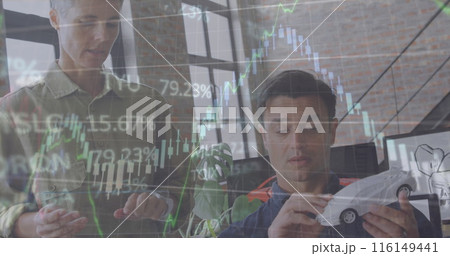 This image is about car designers discussing a model car at a desk in an office 116149441