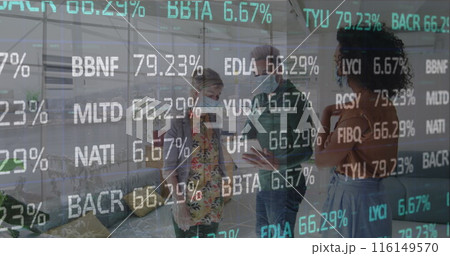 Image of financial data processing over business people wearing face masks working in office 116149570