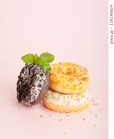 Doughnuts, Chocolate Brown and Pink Donut with Multicolored Sprinkles Doughnuts, Chocolate Brown and Pink Donut with Multicolored Sprinkles 116149824