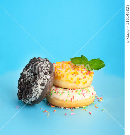 Doughnuts, Chocolate Brown and Pink Donut with Multicolored Sprinkles 116149825