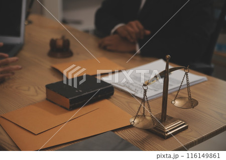 Judge gavel with Justice lawyers having team meeting at law firm background. Concepts of Law and Legal services. 116149861