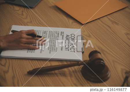 Judge gavel with Justice lawyers having team meeting at law firm background. Concepts of Law and Legal services. 116149877