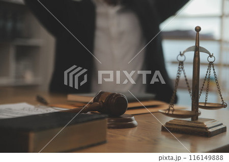 Judge gavel with Justice lawyers having team meeting at law firm background. Concepts of Law and Legal services. Judge gavel with Justice lawyers having team meeting at law firm background. Concepts of Law and Legal services. 116149888
