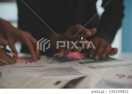 Fund managers team consultation and discuss about analysis Investment stock market at office 116149921