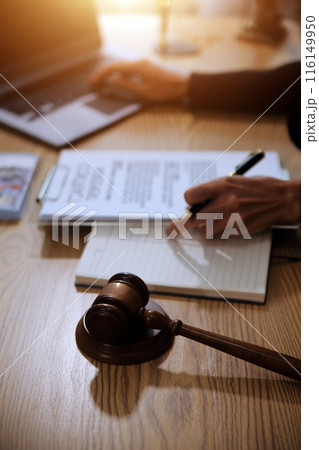 Judge gavel with Justice lawyers having team meeting at law firm background. Concepts of Law and Legal services. Judge gavel with Justice lawyers having team meeting at law firm background. Concepts of Law and Legal services. 116149950
