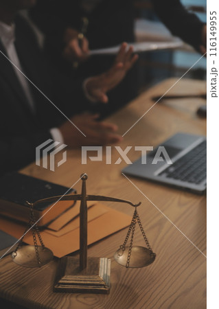 Judge gavel with Justice lawyers having team meeting at law firm background. Concepts of Law and Legal services. Judge gavel with Justice lawyers having team meeting at law firm background. Concepts of Law and Legal services. 116149955