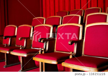 red empty seats for spectators in the theater or cinema close-up 116151228
