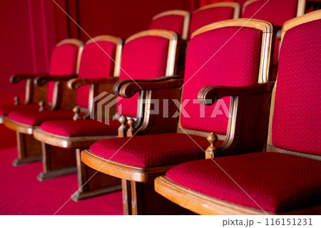 red empty seats for spectators in the theater or cinema close-up 116151231