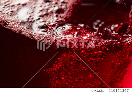 Red wine abstract splashing in glass. 116151347