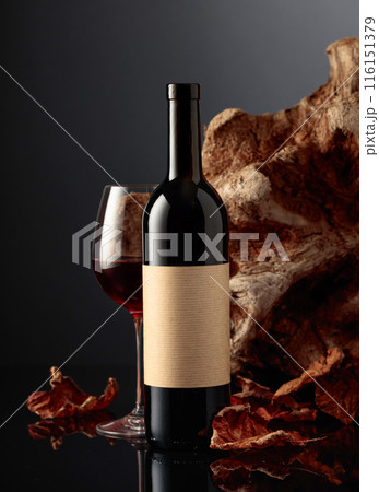 Bottle of red wine with old empty label. Bottle of red wine with old empty label. 116151379