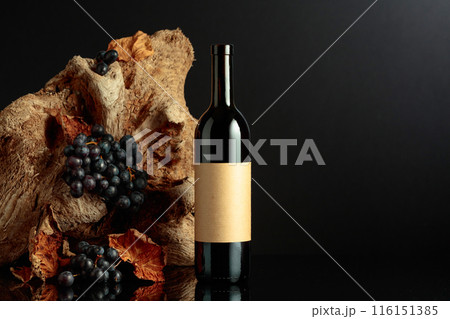 Bottle of red wine with empty label. 116151385