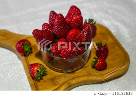 Fresh strawberries in a bowl on the table 116152639
