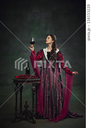 Advertisements for themed wine tasting events. Portrait of Victorian royal person, queen tasting delicious organic wine against vintage green background. Advertisements for themed wine tasting events. Portrait of Victorian royal person, queen tasting delicious organic wine against vintage green background. 116153220