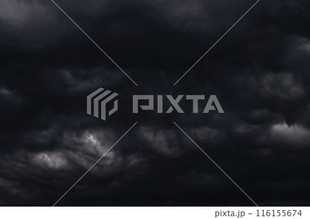 Dark storm clouds gathering in sky creating dramatic scene 116155674