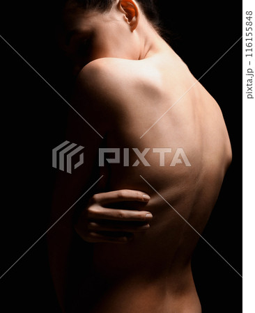 Nude body silhouette. Naked Woman. Beautiful Back in dark 116155848