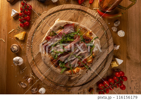Artisan pizza with sun-dried tomatoes 116156179