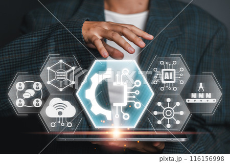 A person interacts with a digital interface displaying technology icons, representing the concept of digital transformation and innovation. 116156998