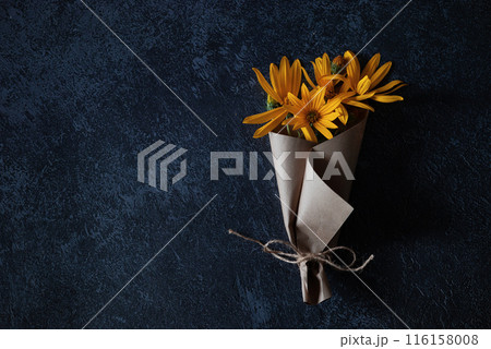 Bouquet of yellow flowers on a dark background in grunge style, abstract floral arrangement, mother's day, wedding gift,spring or autumn background with a place for text, minimalistic holiday concept, 116158008