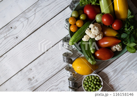 Large plate with various fresh farm vegetables. Autumn harvest and the concept of healthy organic food Large plate with various fresh farm vegetables. Autumn harvest and the concept of healthy organic food 116158146