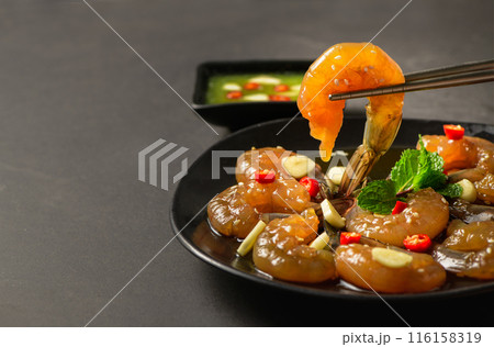 Pickled shrimp with chopstick Soy Sauce, chilli and garlic on stone background, Pickled shrimp with chopstick Soy Sauce, chilli and garlic on stone background, 116158319