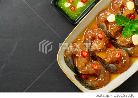 Pickled shrimp in soy sauce, chilli and garlic on stone background, korean food 116158330