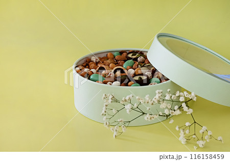 Peanuts in box. Gift to Women's Day (8 March), Women's Day. Mother's Day Valentines day. Festive round box. 116158459