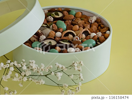 Peanuts in box. Gift to Women's Day (8 March), Women's Day. Mother's Day Valentines day. Festive round box. 116158474