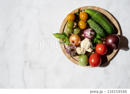 Large plate with various fresh farm vegetables. Autumn harvest and the concept of healthy organic food 116158588